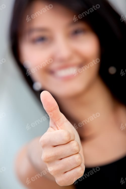 Preview: Business Woman With Thumbs Up And Smiling