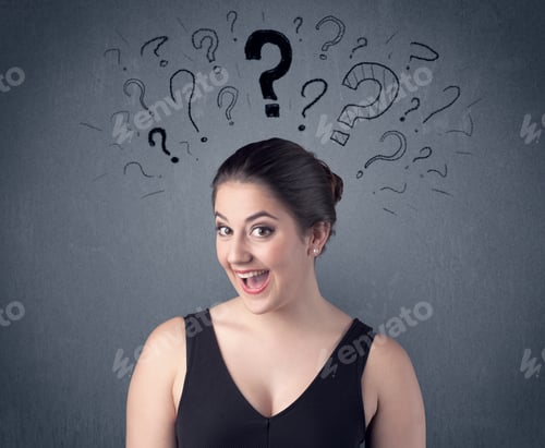 Preview: A Pretty Teenage Girl Standing Confused In Front Of Grey Wall Background With Drawn Question Marks