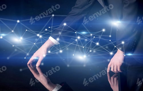 Preview: Male Hands Touching Interactive Table With Blue Connectivity Graphic In The Background
