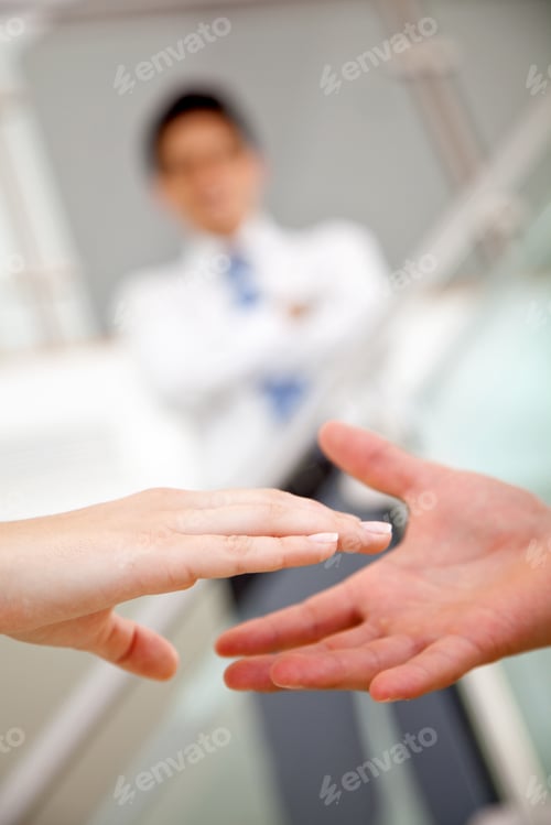 Preview: Business People Sealing The Deal Handshaking In An Office