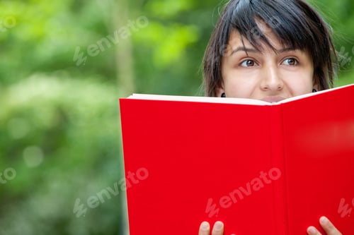 Preview: Female University Student With A Notebook Outdoors