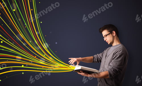 Preview: Young Man Reading A Book While Colorful Lines Are Coming Out Of The Book