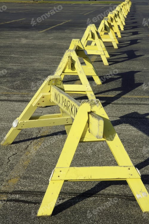Preview: Row Of "No Parking" Barriers Across Parking Lot