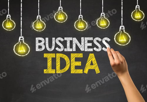 Preview: Female Hand Holding White Chalk In Front Of A Blackboard With Business Idea Written On It