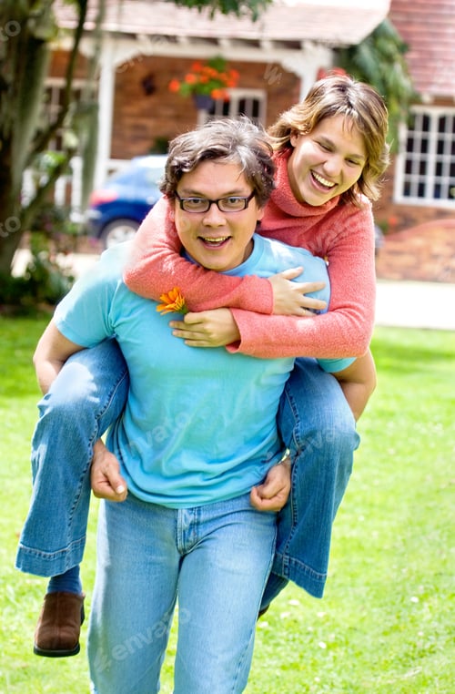 Preview: Couple Smiling And Having Fun Outdoors At Home