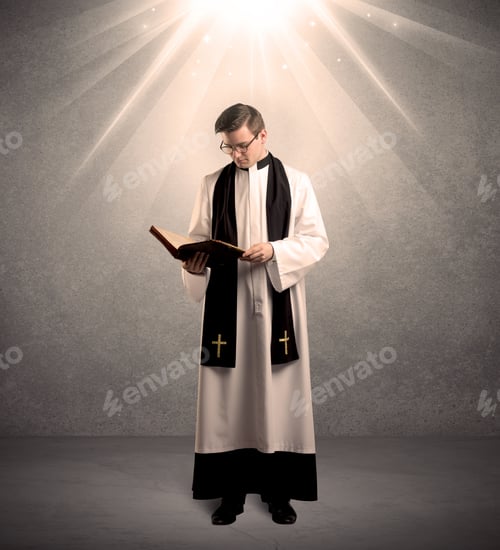 Preview: A Male Religious Young Priest In Black And White Dress Giving His Blessing, Holding The Holy Bible