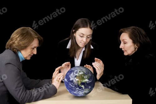 Preview: Business Female Management Team With Hands Over Earth Globe With A Black Background