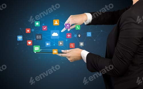 Preview: Female Hand Touching Tablet With Application Icons Above