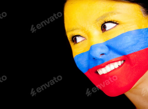 Preview: Woman With The Flag Colombia Painted On Her Face - Isolated Over A Black Background