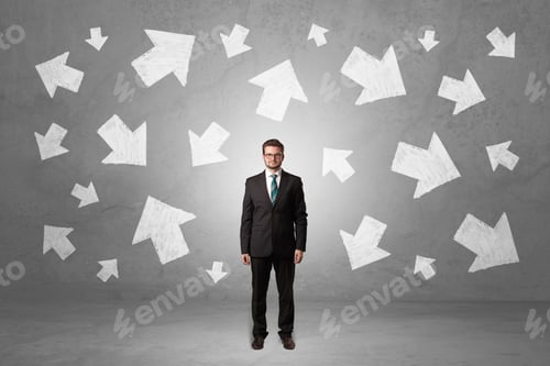 Preview: Handsome Businessman Standing In Front Of A Wall With Chalk Drawn Arrows