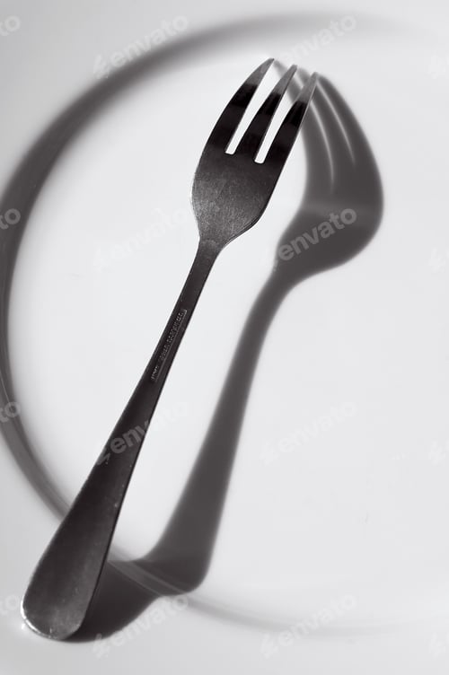 Preview: Stainless Steel Fork With Shadow On Dinner Plate
