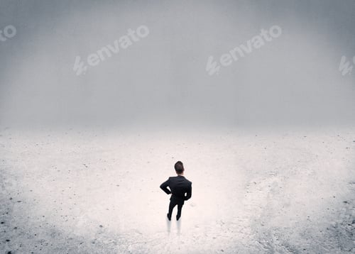 Preview: An Adult Elegant Businessman Standing In The Middle Of Nowhere In Empty Grey Concrete Space