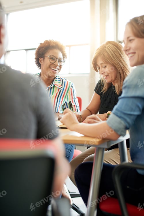 Preview: Unposed Group Of Creative Business People In An Open Concept Office Brainstorming Their Next