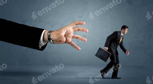 Preview: Business Man Running Away From A Huge Hand Concept On Background