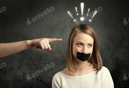 Preview: Caucasian Hand Pointing At Female Employee With Drawn Exclamation Marks Above Her Head