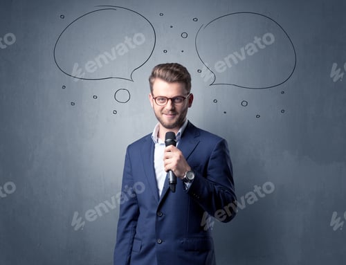 Preview: Businessman Speaking Into Microphone With Speech Bubbles Over His Head