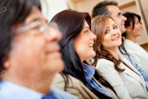 Preview: Business Woman Standing Out From A Group In A Row