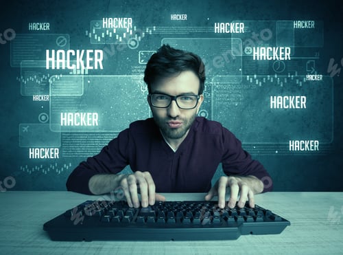 Preview: A Young Handsome Nerd Hacking Internet Web Sites While Working On Computer Keyboard, With Digital