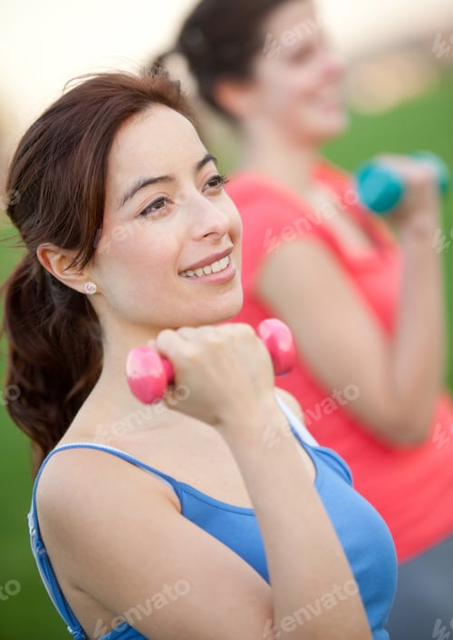 Preview: Beautiful Girls Exercising Outdoors With Free Weights