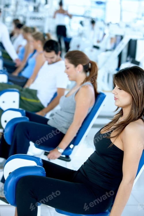 Preview: Group Of People Exercising With The Machines At The Gym