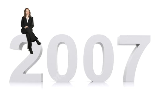 Preview: Business Woman Sitting On The New Year 2007 On White