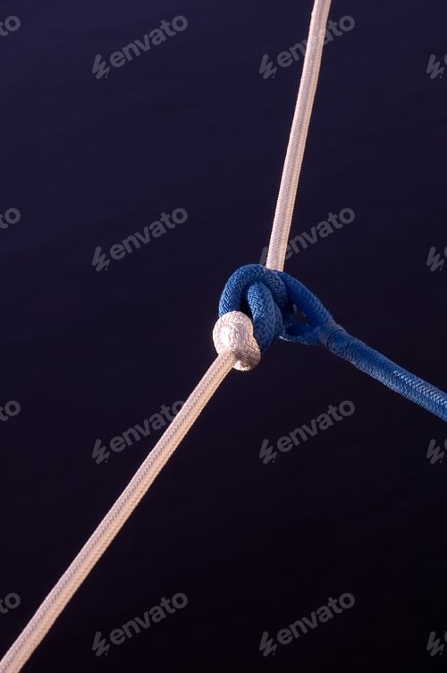 Preview: Blue Nautical Rope Tied To White Over Dark Water