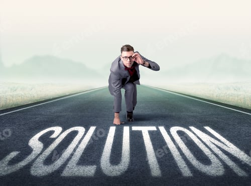 Preview: Young Determined Businessman Kneeling Before Solution Text