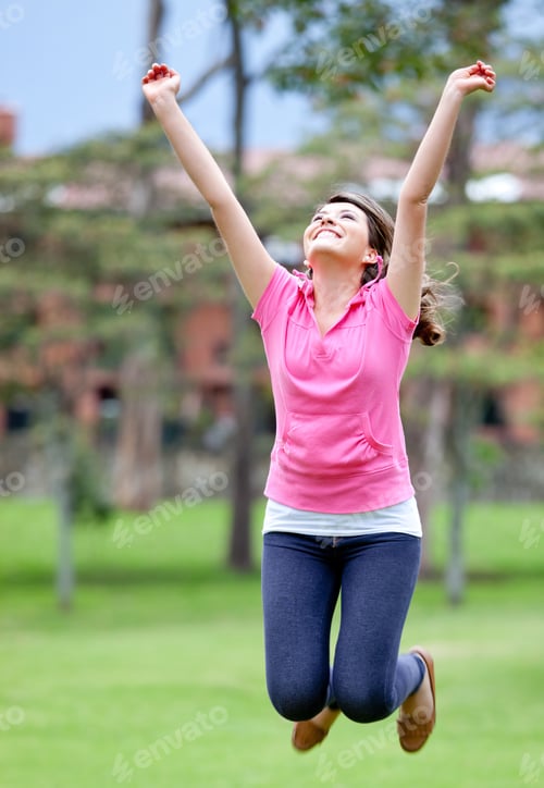 Preview: Excited Young Woman Jumping Outdoors And Enjoying Nature