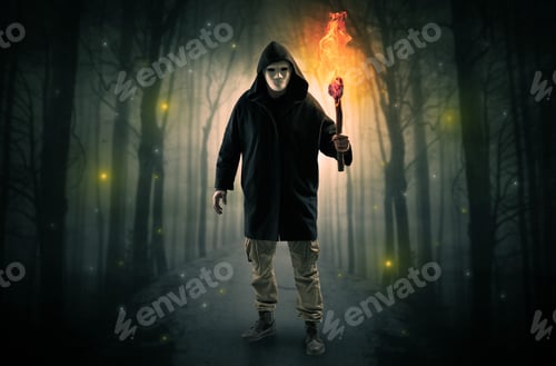 Preview: Mysterious Man Coming From A Path In The Forest With Burning Flambeau Concept