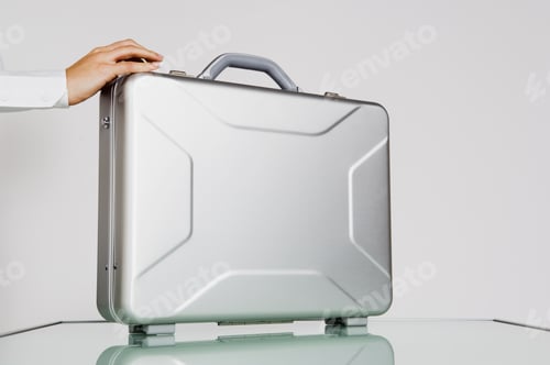 Preview: Woman'S Hand On A Brief Case.