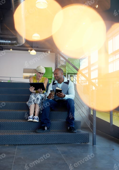 Preview: Two Creative Millenial Small Business Owners Working On Social Media Strategy Using A Digital