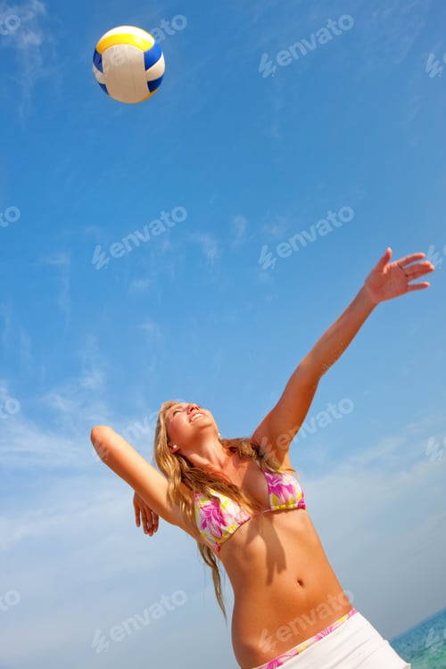 Preview: Beautiful Girl Playing Volleyball At The Beach