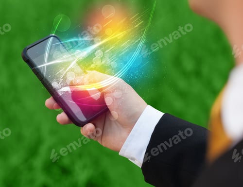 Preview: Hand Holding Smart Phone With Abstract Glowing Lines Concept