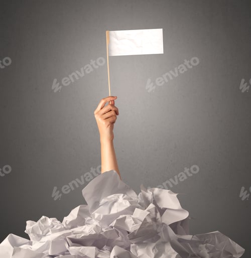 Preview: Female Hand Emerging From Crumpled Paper Pile Holding A White Blank Flag