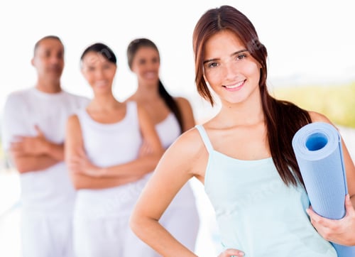 Preview: Woman In A Yoga Class Holding Mat And Smiling