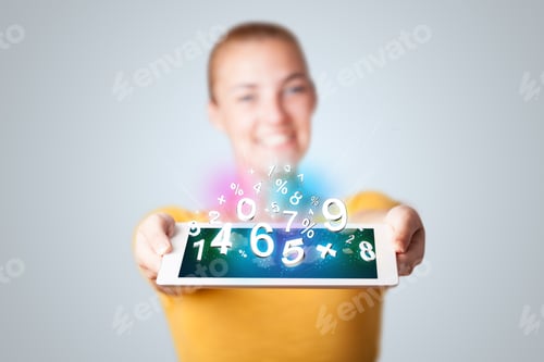 Preview: Beautiful Young Woman Holding Tablet With Numbers