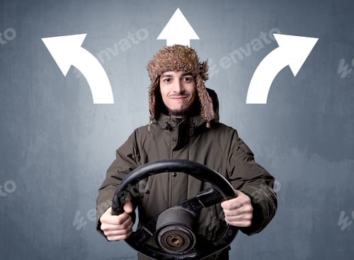 Preview: Young Man Holding Black Steering Wheel With Three Arrows Above His Head Pointing In Different