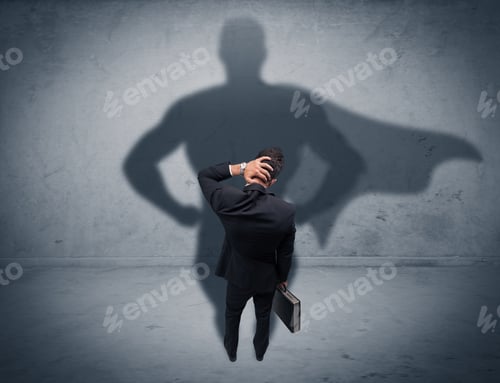 Preview: A Confident Young Elegant Salesman With Briefcase Facing A Wall, Looking At His Superman Shadow