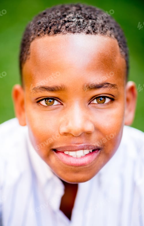 Preview: Portrait Of An African American Boy Smiling At The Park