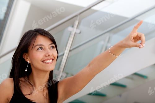 Preview: Business Woman Pointing At Something At The Office