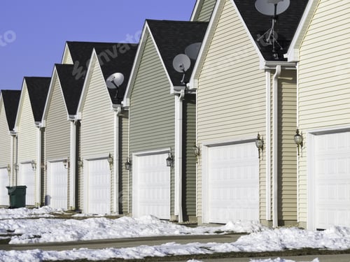 Preview: Building Conformity: Row Of Nearly Identical One-Car Garages In Winter
