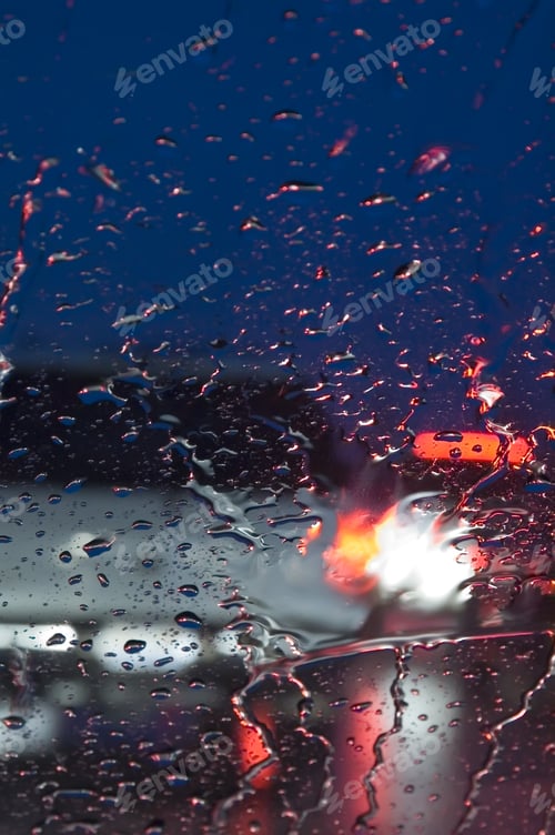 Preview: Rear Of Car Seen Through Windshield In Rain