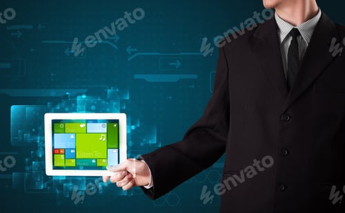 Preview: Young Businessman Holding A Tablet With Modern Software Operational System