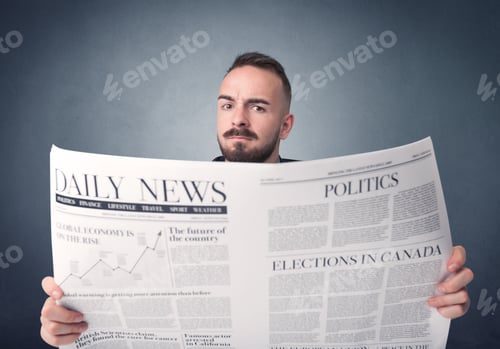 Preview: Young Smart Businessman Reading Daily Newspaper