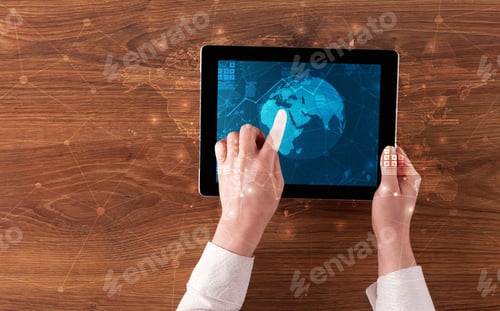 Preview: Hand Touching Tablet With Worldwide Reports Links And Statistics Concept
