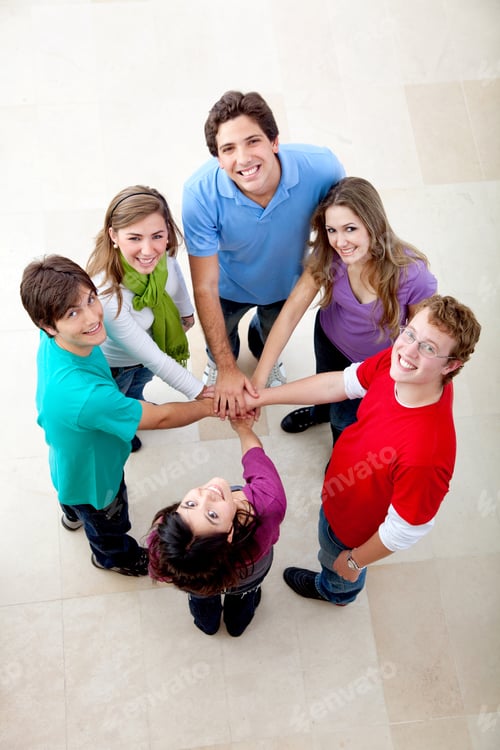 Preview: Happy Group Of Friends With Hands Together On The Middle