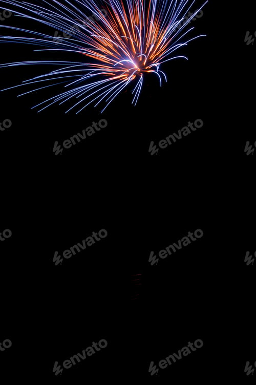 Preview: Burst Of Fireworks With Blue And Orange Streaks Near Top Of Frame