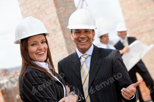 Preview: Elegant Couple Of Engineers Smiling In A Construction Site
