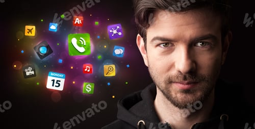 Preview: Portrait Of A Young Businessman With Colorful Applications Next To Him On A Dark Background
