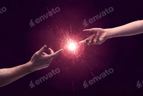 Preview: White Caucasian Male Hands Reaching Out With Fingers Almost Touching In Bright Red Light Sparkle In